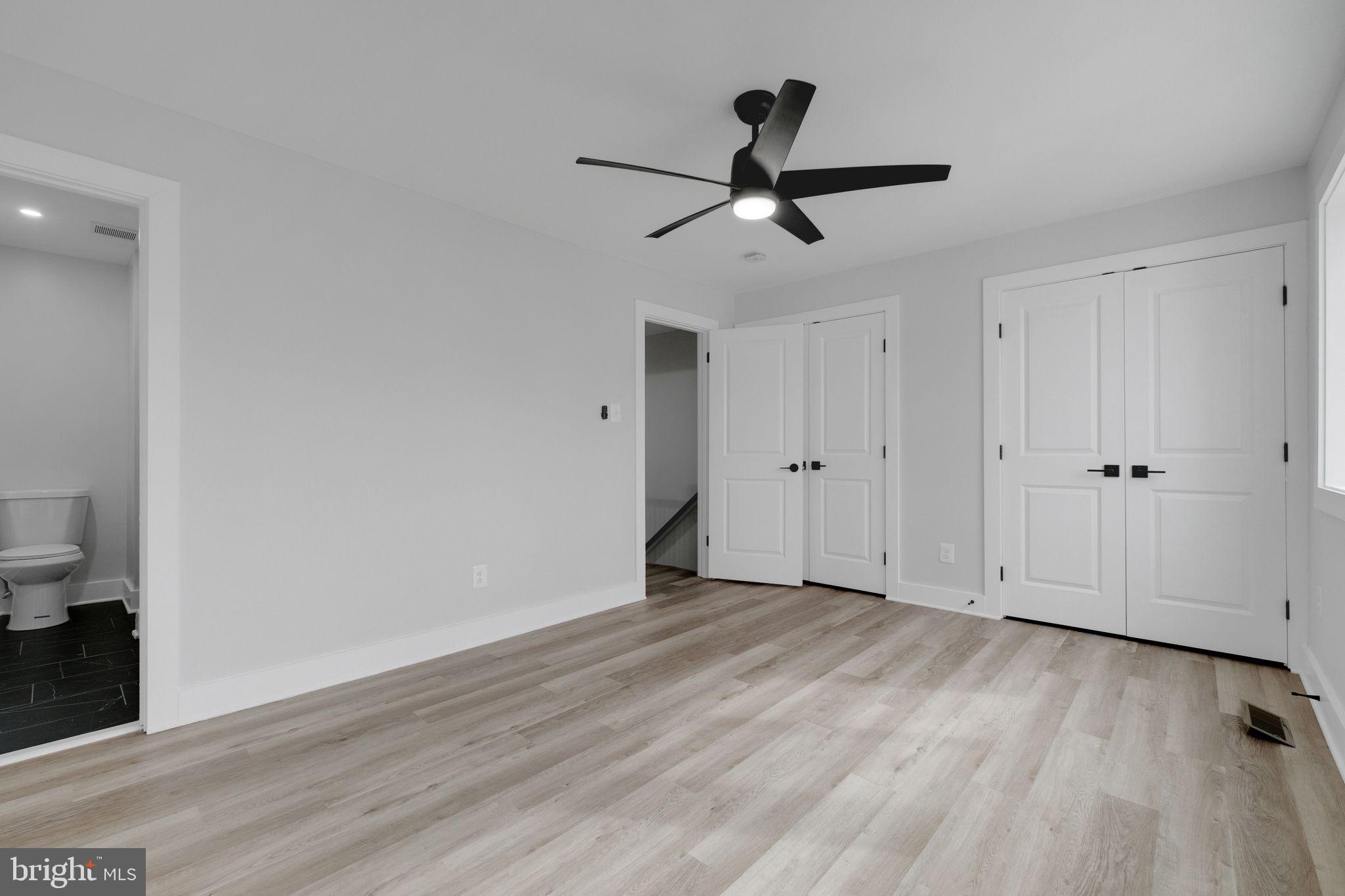 2503 Naylor Road Southeast Washington, DC 20020 - Photo 24 of 31 a view of empty room with wooden floor and ceiling fan