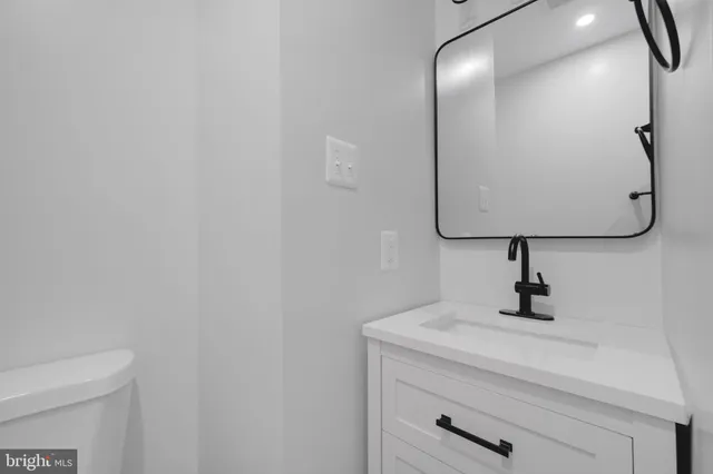 a bathroom with a sink and mirror