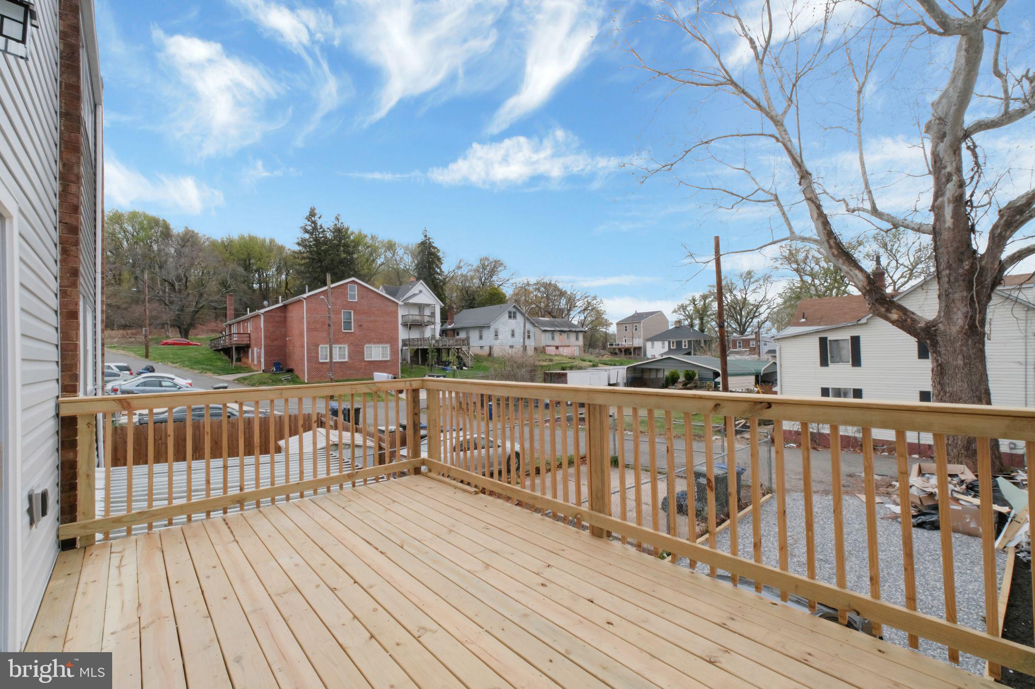 2503 Naylor Road Southeast Washington, DC 20020 - Photo 31 of 31 a view of a wooden deck with a yard