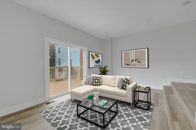 a living room with furniture and a rug