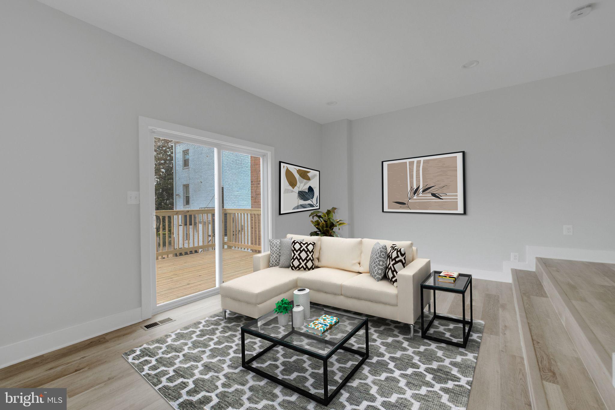 2503 Naylor Road Southeast Washington, DC 20020 - Photo 5 of 31 a living room with furniture and a rug