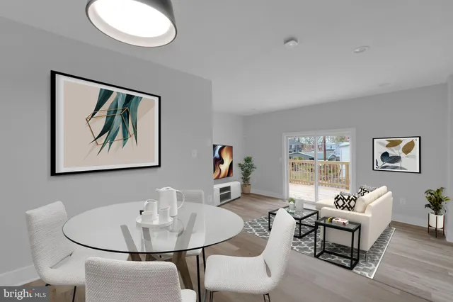 a living room with furniture and a painting