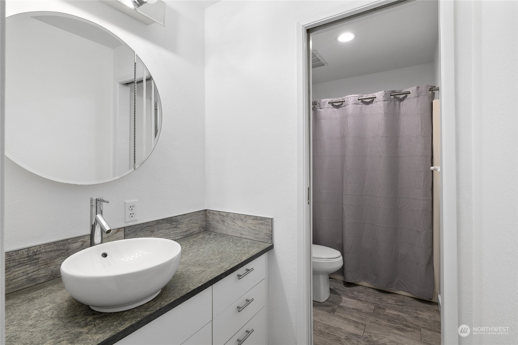 30 Crawford Ronald, WA 98940 - Photo 11 of 30 a bathroom with a granite countertop sink toilet a mirror and shower