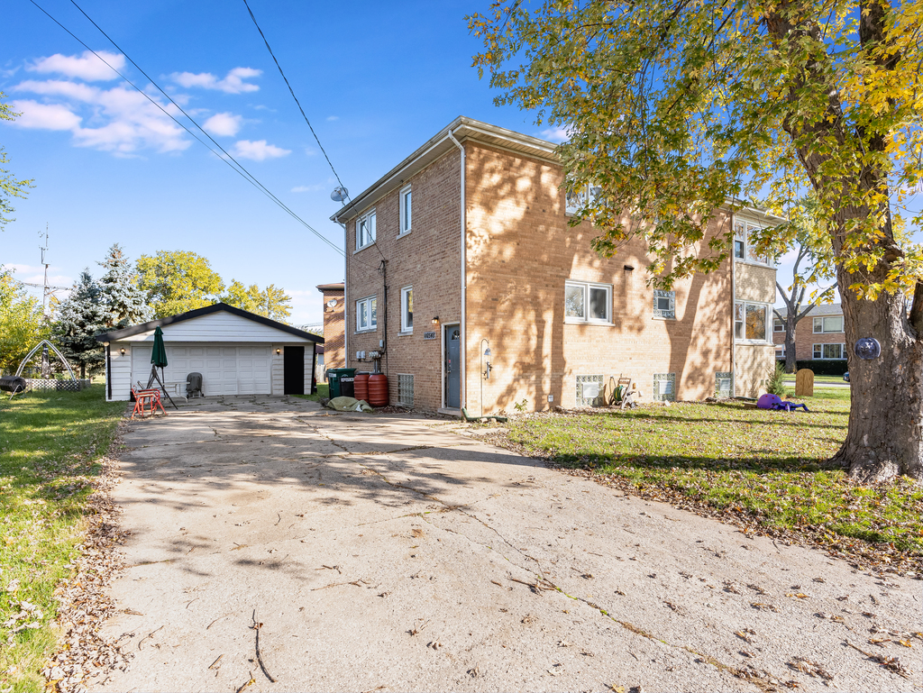 10548 Mason Avenue, Unit 2 Chicago Ridge, IL 60415 - Photo 12 of 13 a view of a house with a yard