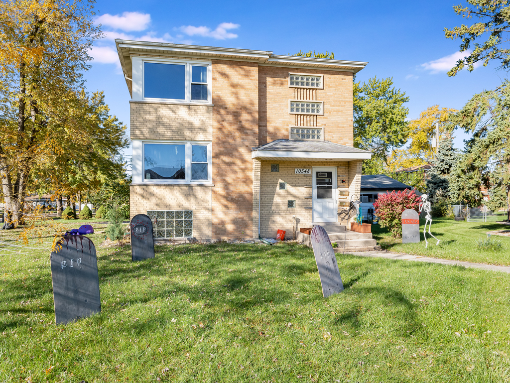 10548 Mason Avenue, Unit 2 Chicago Ridge, IL 60415 - Photo 13 of 13 a view of a house with a yard and sitting area