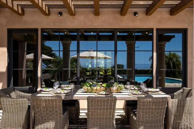 a view of an outdoor dining space with furniture