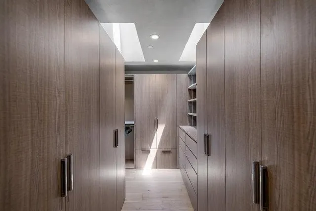 a large bedroom with furniture fireplace and flat screen tv