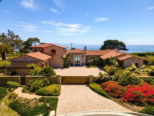 an aerial view of a house with a garden