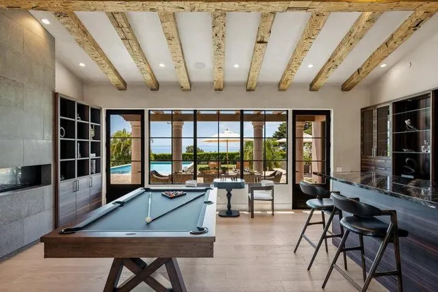 a living room with furniture a rug and a flat screen tv