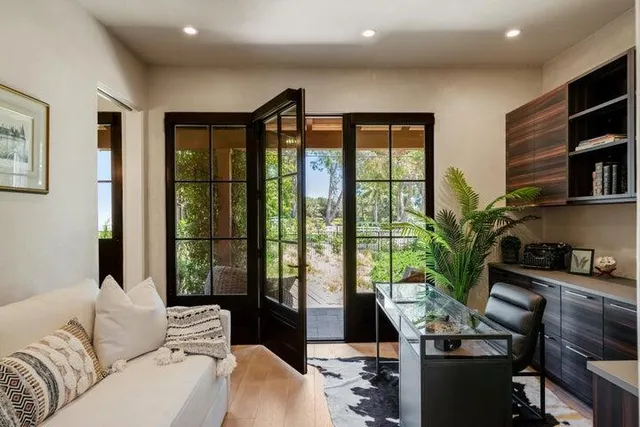 a view of a swimming pool and lounge chairs