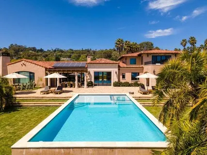 a view of a house with swimming pool