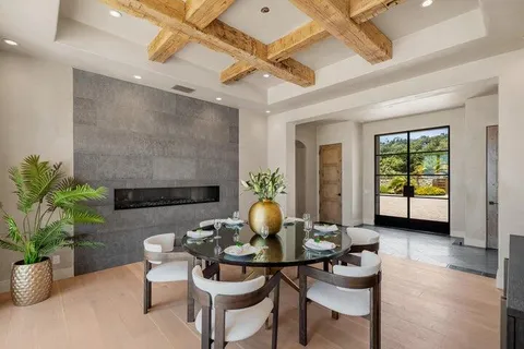 a kitchen with stainless steel appliances a sink stove and cabinets
