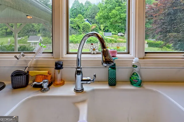 a bedroom with a bed and a furniture in it