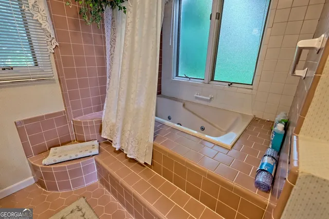 a view of a livingroom with furniture and a rug
