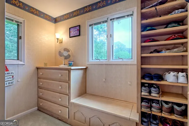 a bedroom with a bed and dresser