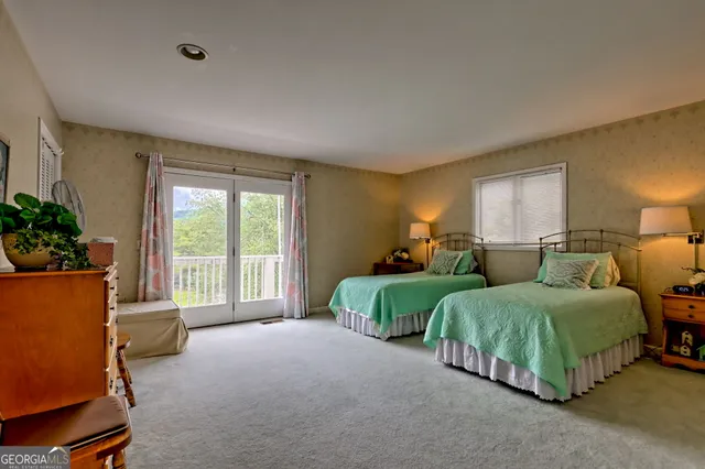 a bathroom with a tub a sink and a mirror