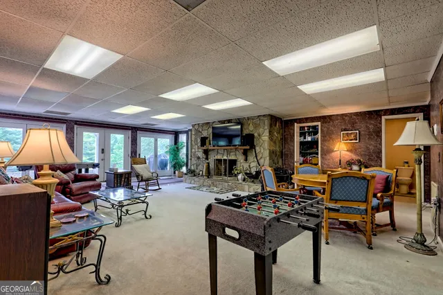 a front view of a house with a yard table and chairs