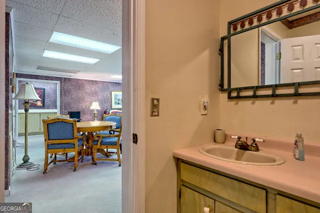 a view of a house with a yard patio and a garden