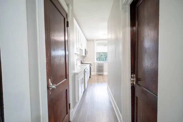 a view of a kitchen from the hallway