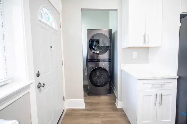 a view of a hallway with washer and dryer