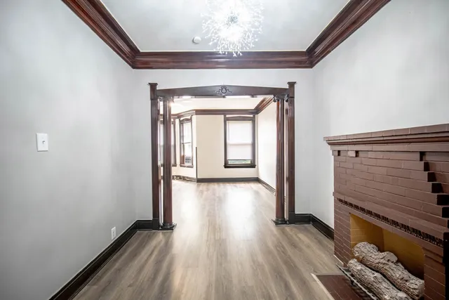 a view of hallway with wooden floor