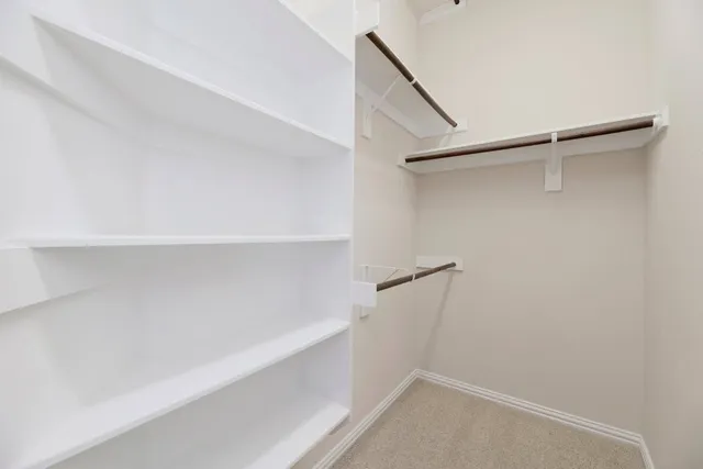 a view of an empty walk in closet
