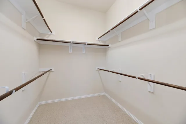 a view of an empty walk in closet