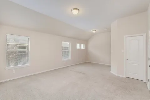 a kitchen with stainless steel appliances granite countertop a sink a stove and white cabinets