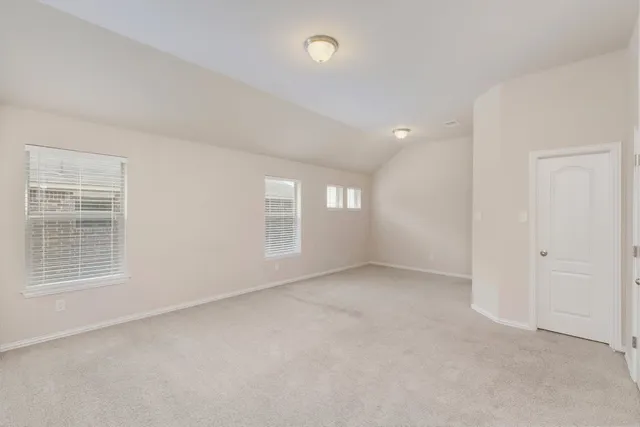 a kitchen with stainless steel appliances granite countertop a sink a stove and white cabinets