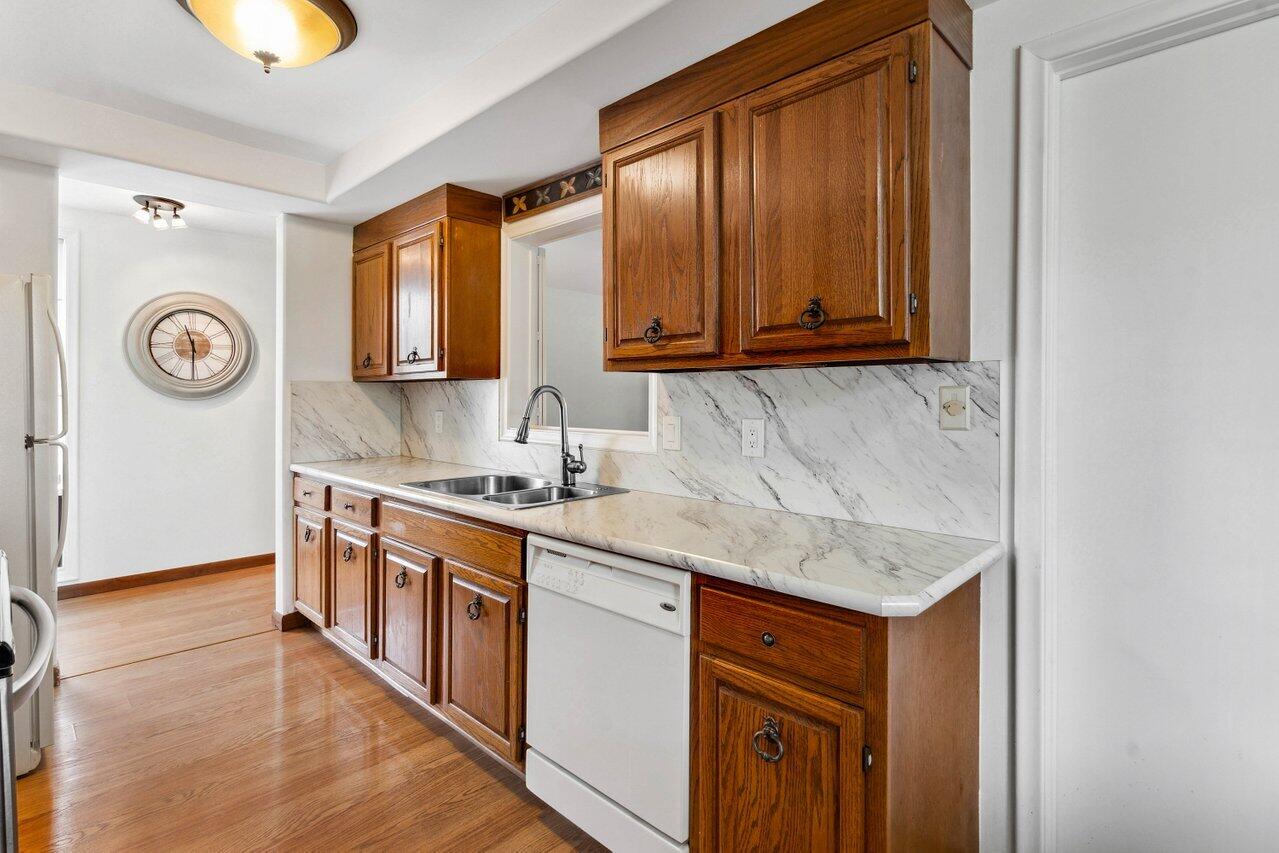 19867 Boca W Drive, Unit 3262 Boca Raton, FL 33434 - Photo 13 of 36 a kitchen with stainless steel appliances granite countertop a stove and a sink