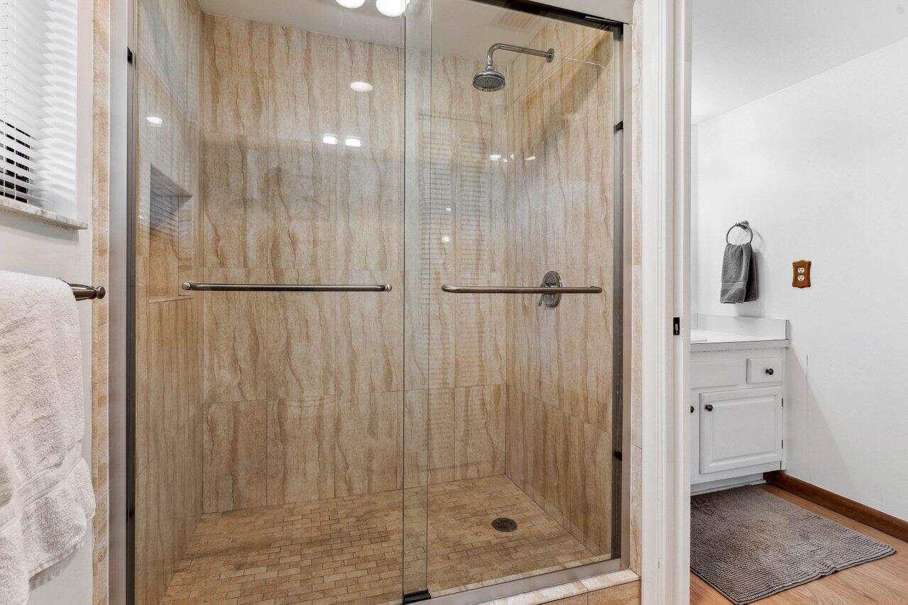 19867 Boca W Drive, Unit 3262 Boca Raton, FL 33434 - Photo 21 of 36 a bathroom with a shower