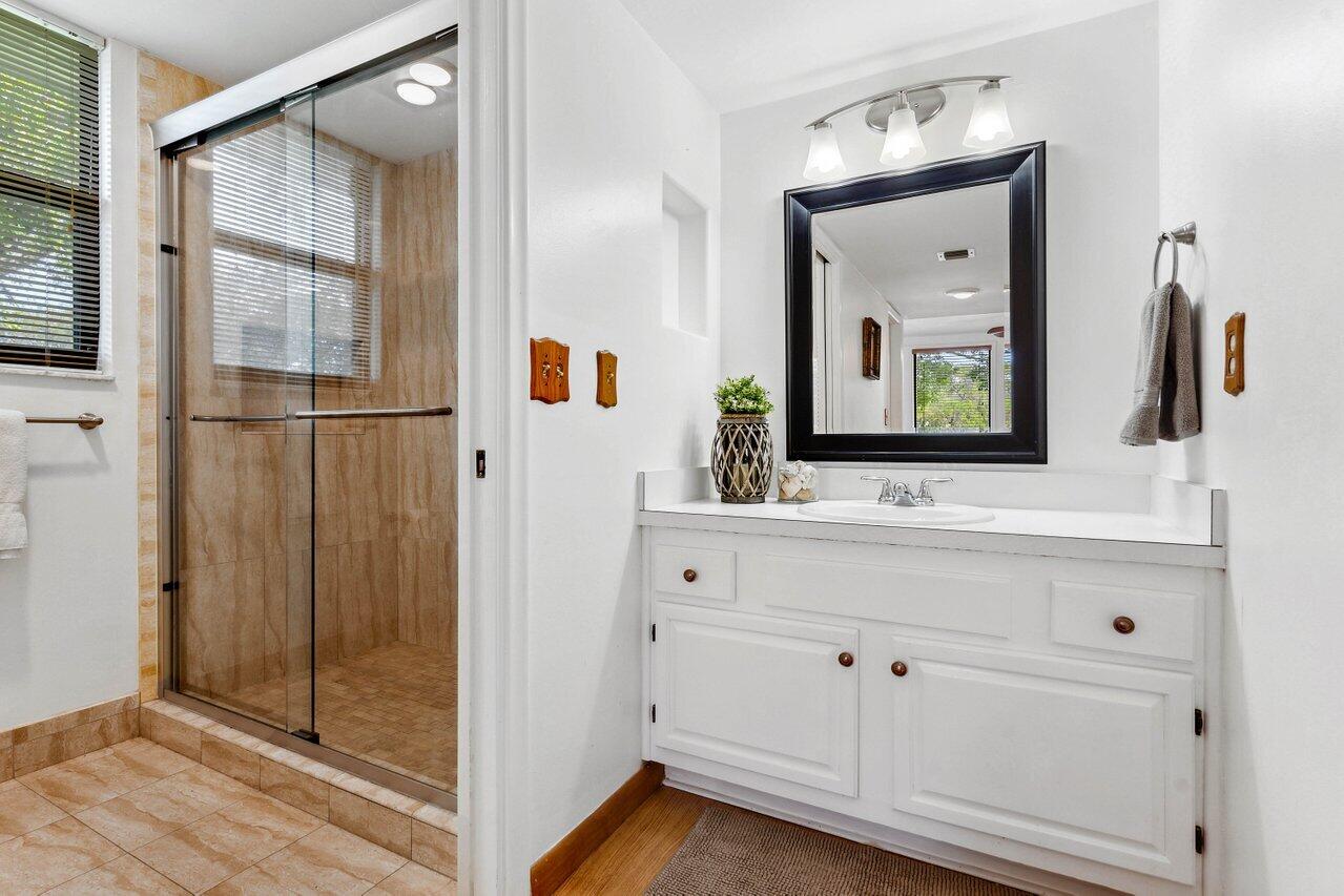 19867 Boca W Drive, Unit 3262 Boca Raton, FL 33434 - Photo 22 of 36 a view of bathroom with mirror and window