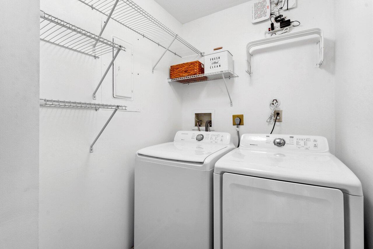 19867 Boca W Drive, Unit 3262 Boca Raton, FL 33434 - Photo 24 of 36 a utility room with dryer and washer