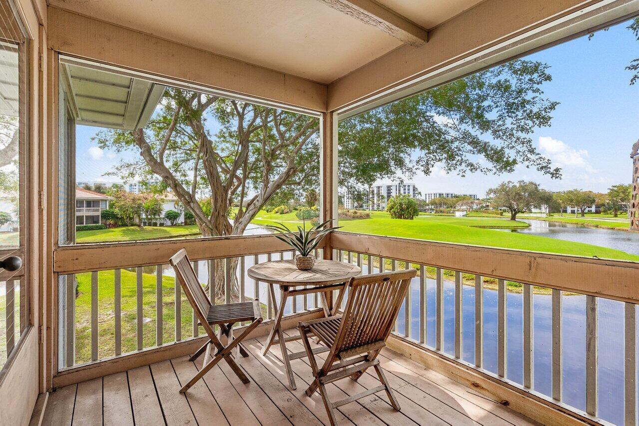 19867 Boca W Drive, Unit 3262 Boca Raton, FL 33434 - Photo 25 of 36 a view of a chairs and table in the balcony
