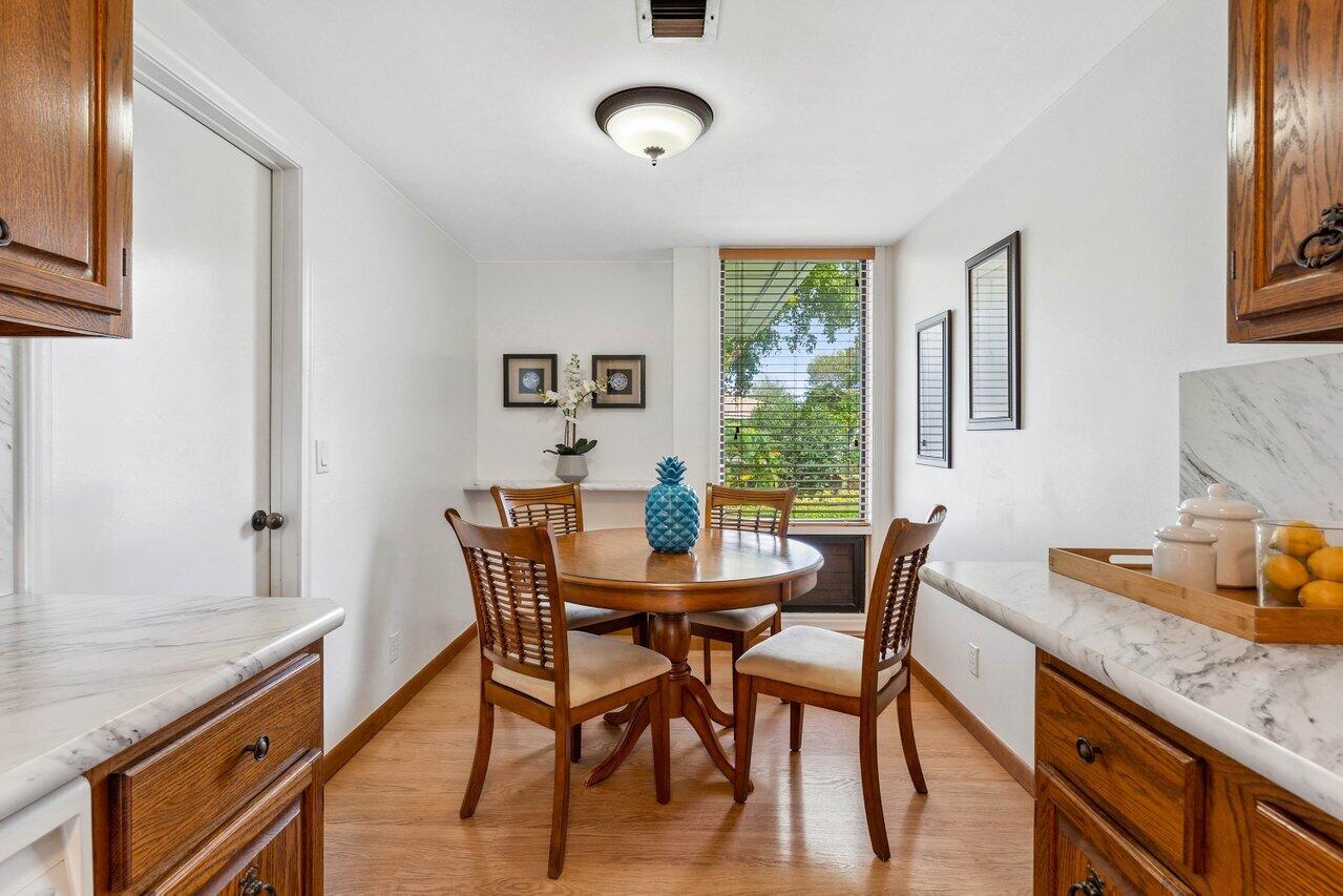 19867 Boca W Drive, Unit 3262 Boca Raton, FL 33434 - Photo 9 of 36 a view of a dining room with furniture window and outside view