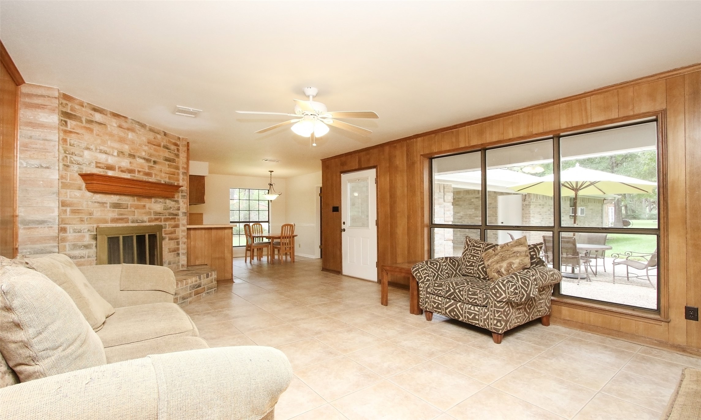 17406 Bobcat Trail Cypress, TX 77429 - Photo 12 of 28 a living room with furniture and a fireplace