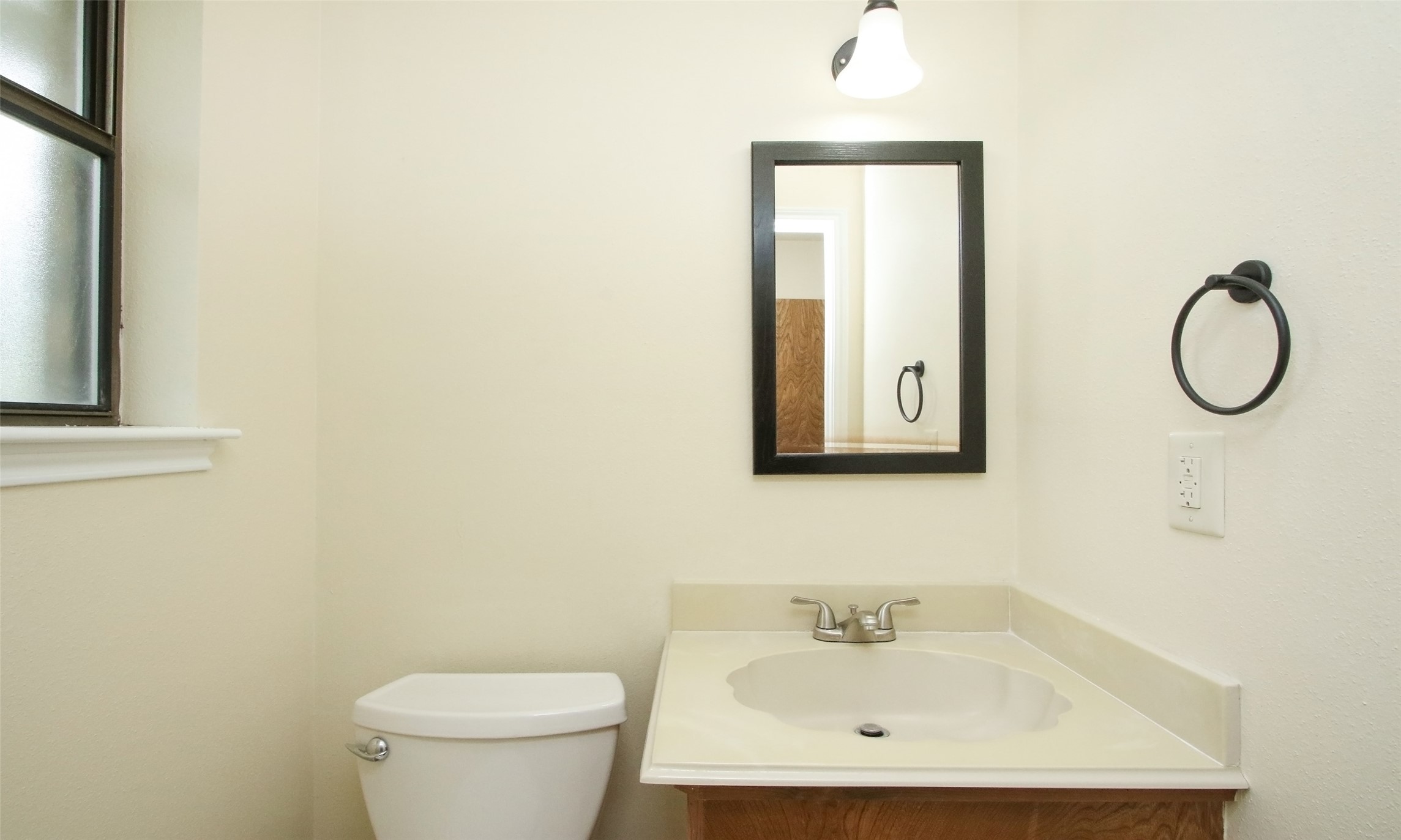 17406 Bobcat Trail Cypress, TX 77429 - Photo 13 of 28 a bathroom with a toilet sink and mirror