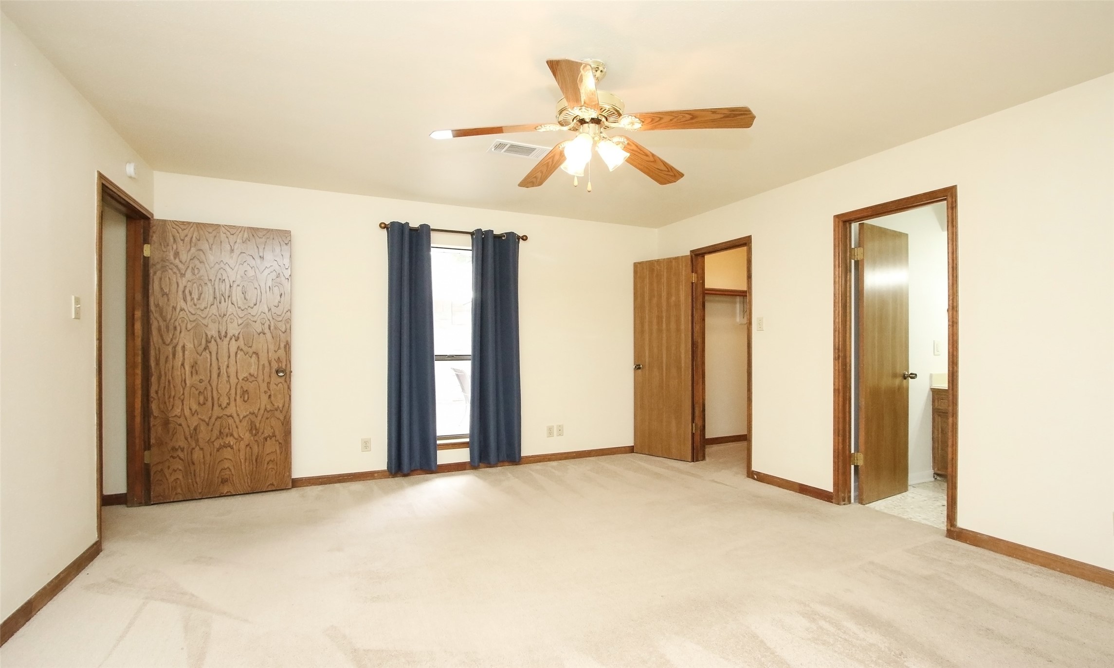 17406 Bobcat Trail Cypress, TX 77429 - Photo 15 of 28 a view of a livingroom with a chandelier fan and a window