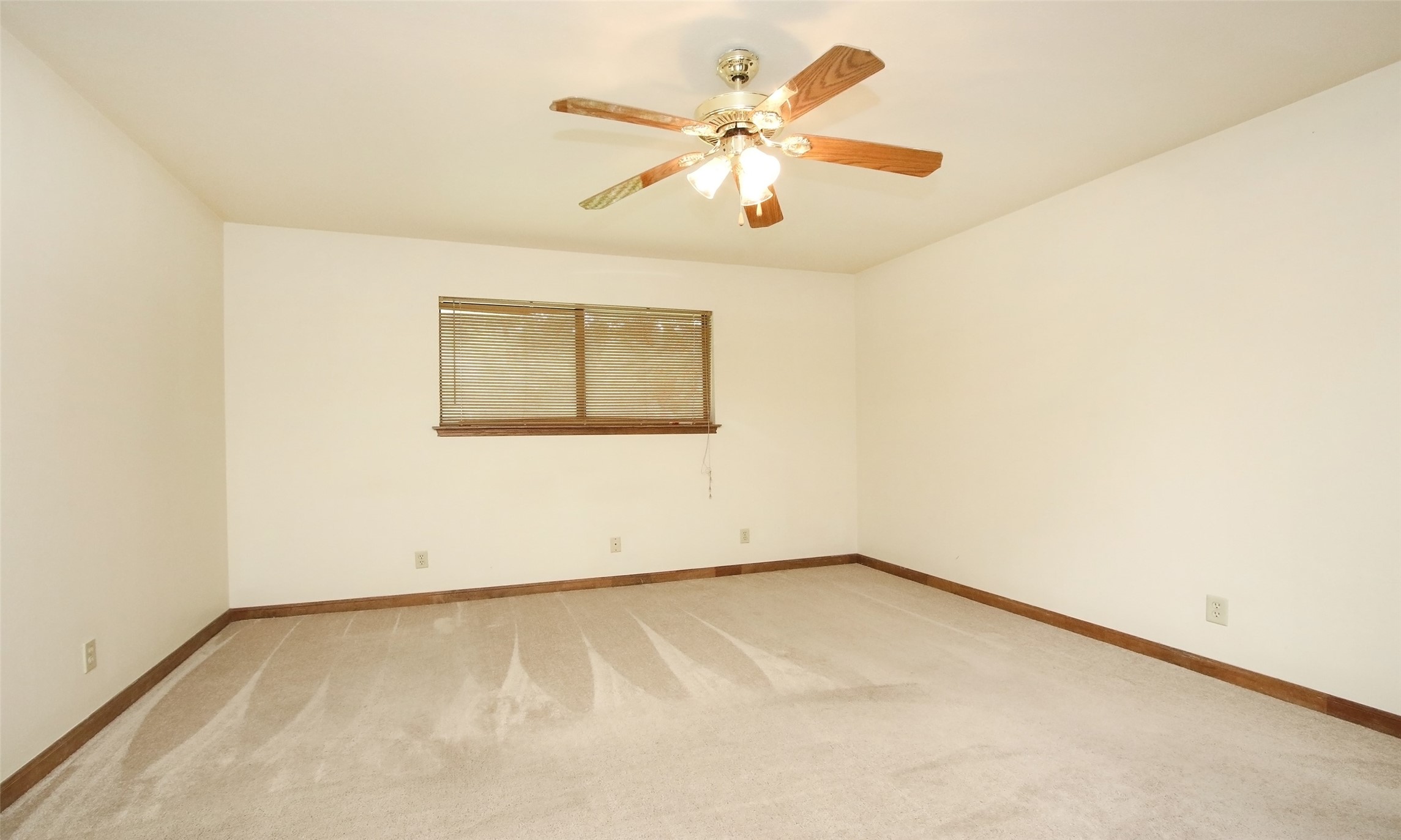 17406 Bobcat Trail Cypress, TX 77429 - Photo 17 of 28 an empty room with a window and a ceiling fan
