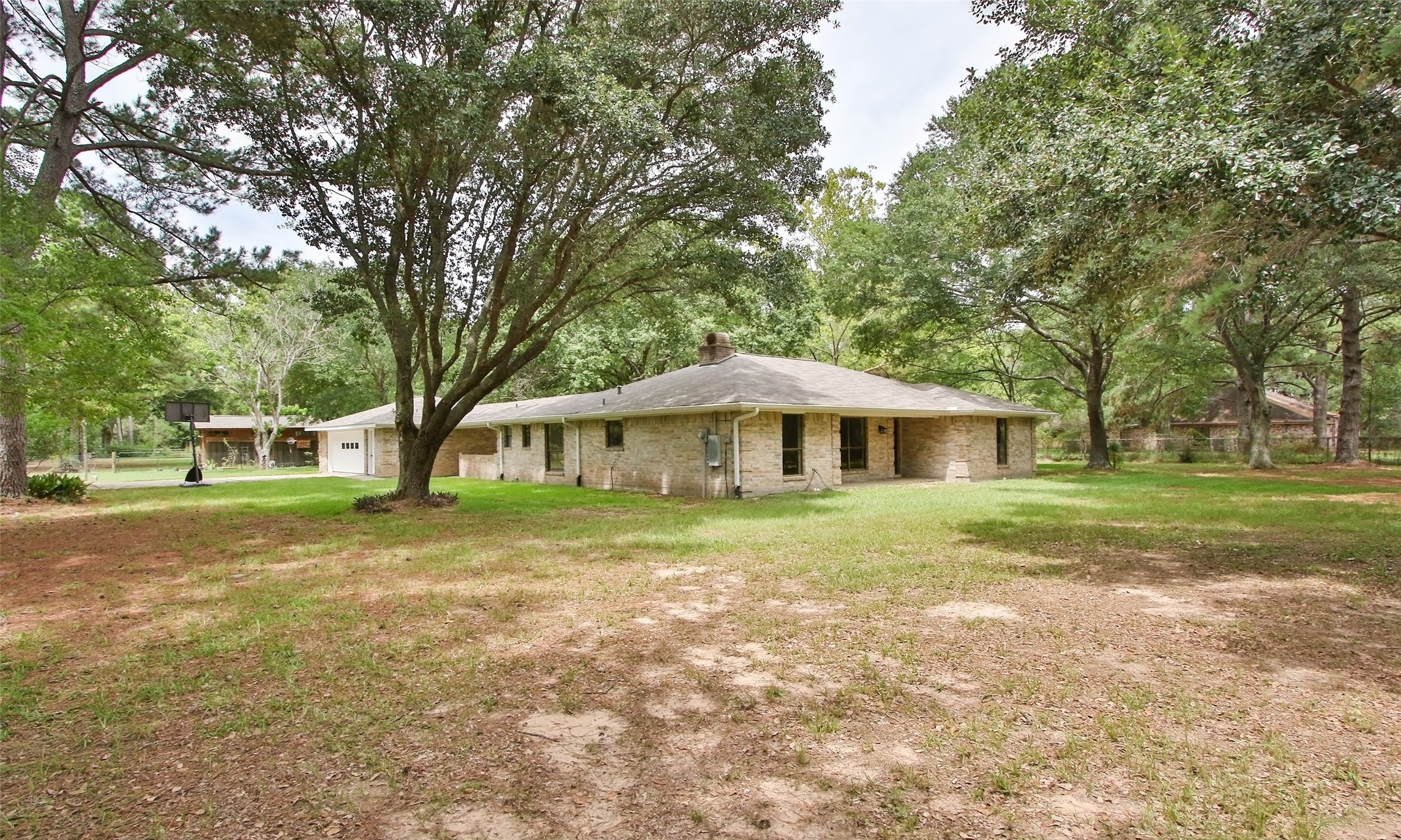 17406 Bobcat Trail Cypress, TX 77429 - Photo 22 of 28 a yellow house in middle of the forest
