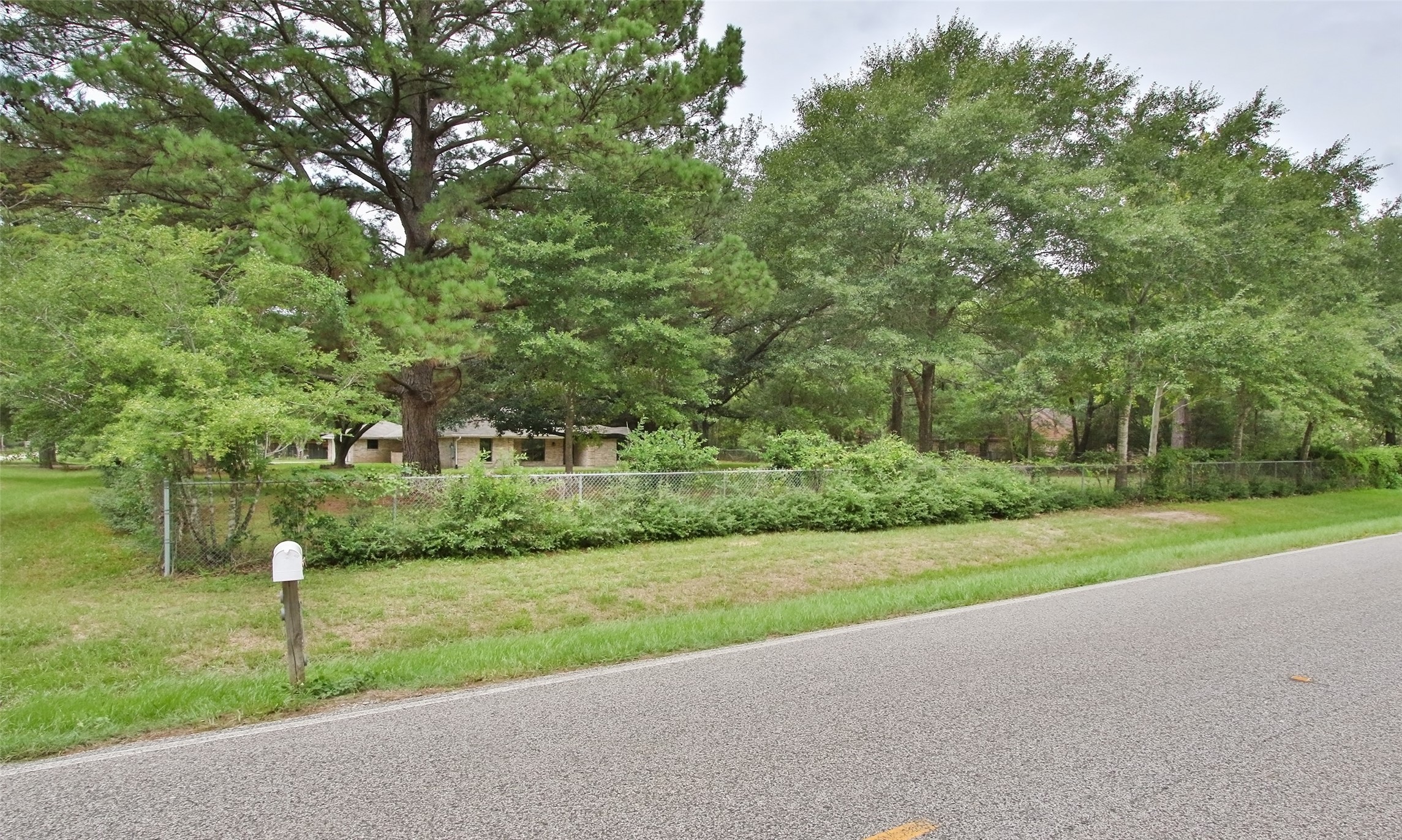 17406 Bobcat Trail Cypress, TX 77429 - Photo 24 of 28 a view of a house with a big yard and a large tree