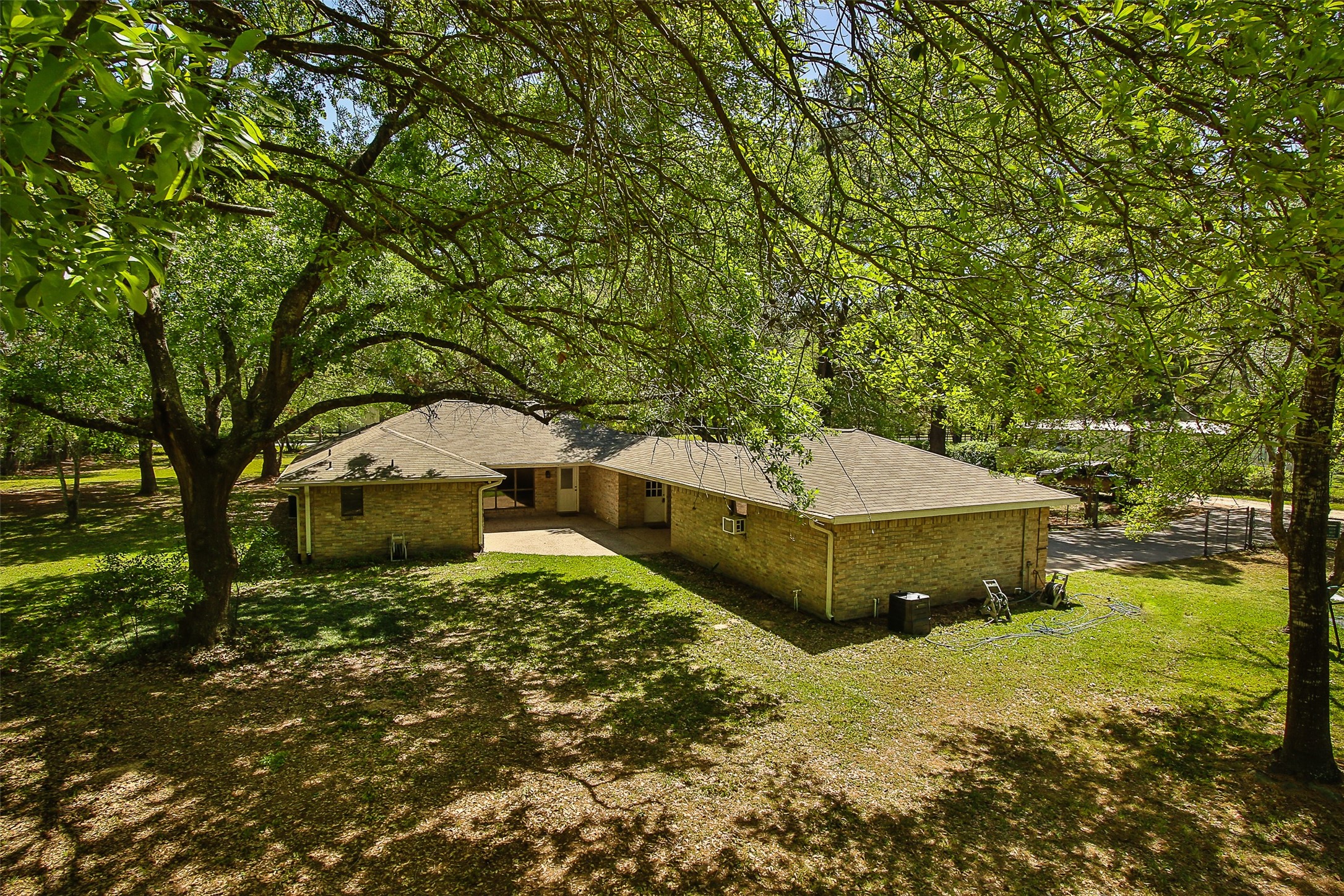 17406 Bobcat Trail Cypress, TX 77429 - Photo 26 of 28 a garden view with a seating space