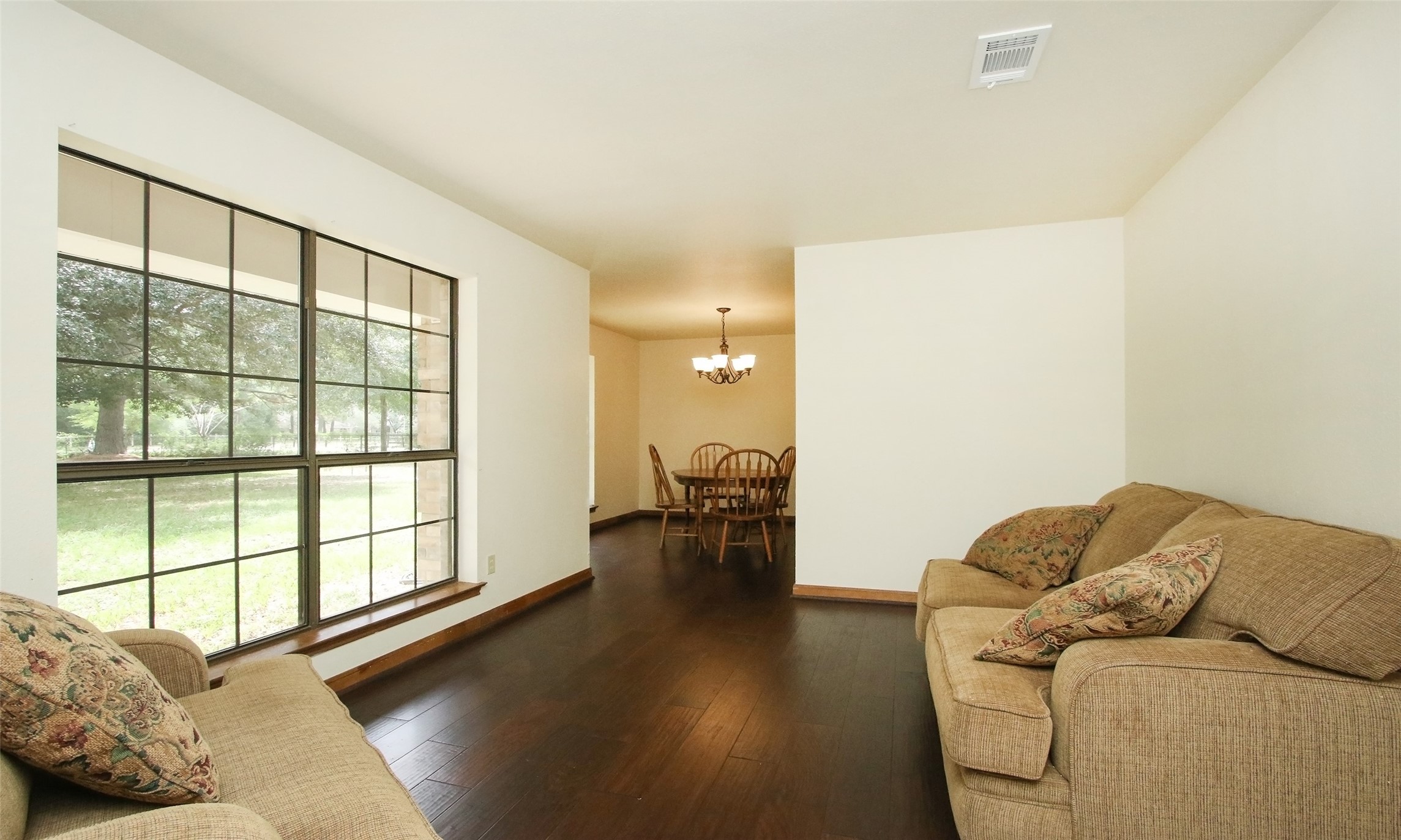 17406 Bobcat Trail Cypress, TX 77429 - Photo 7 of 32 a living room with furniture and a large window