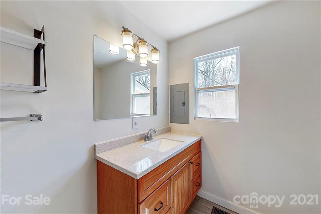 612 Ginger Cake Road Lancaster, SC 29720 - Photo 19 of 35 a bathroom with a sink a vanity and a mirror