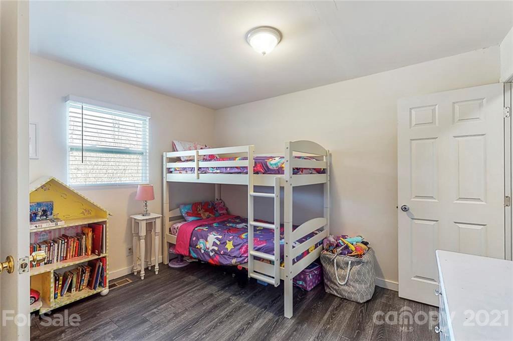 612 Ginger Cake Road Lancaster, SC 29720 - Photo 24 of 35 a bedroom with a bed and wooden floor