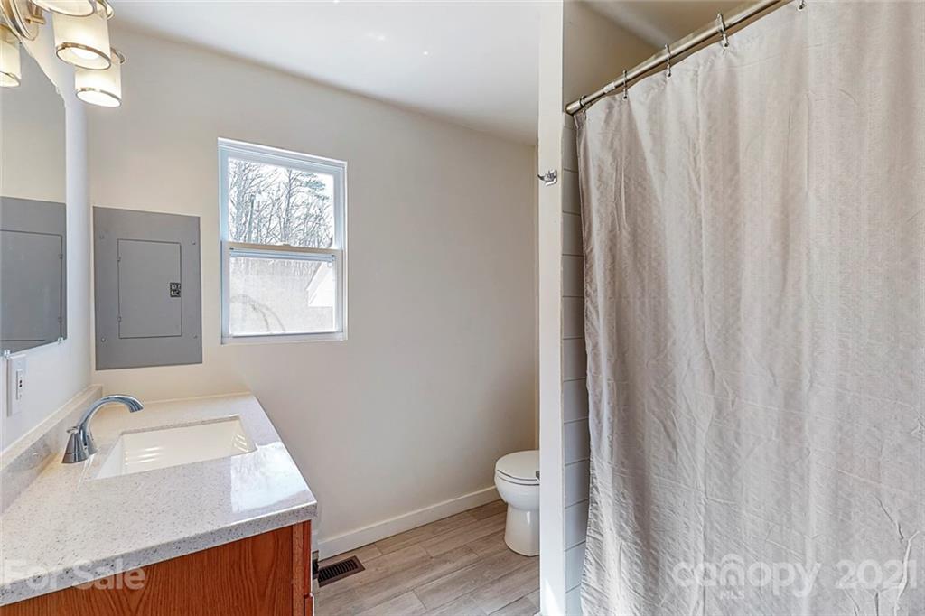 612 Ginger Cake Road Lancaster, SC 29720 - Photo 26 of 35 a bathroom with a sink a toilet and shower curtain