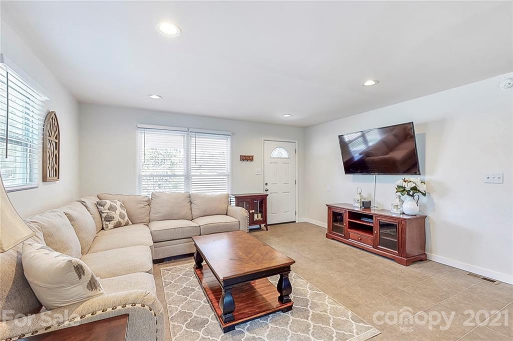 612 Ginger Cake Road Lancaster, SC 29720 - Photo 7 of 35 a living room with furniture and a flat screen tv