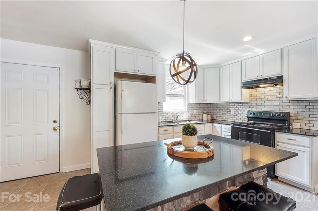 612 Ginger Cake Road Lancaster, SC 29720 - Photo 10 of 35 a kitchen with stainless steel appliances granite countertop a sink a stove and a refrigerator