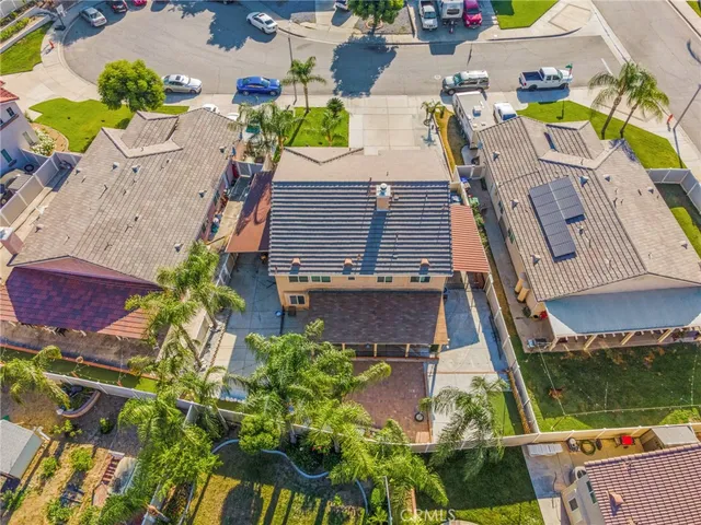 an aerial view of a house with a garden