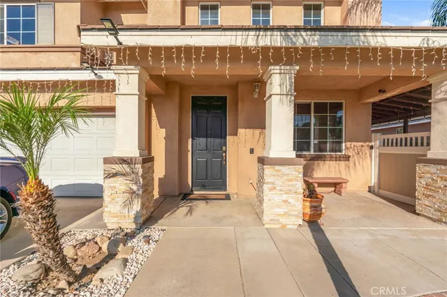 a front view of a building with a garden